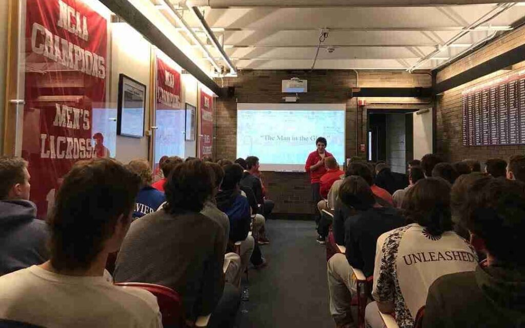 Topher speaking to cornell's lacrosse team